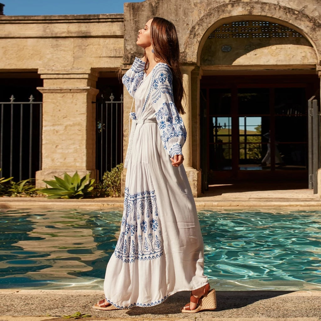 Bahia Maxi Dress White With Blue Embroidery Long Puffed Peasant Sleeves Embroidered Pockets Bohemian Tassel Ties Available In Small Medium Large Or XL Bahia Maxi Dress White With Blue Embroidery Long Puffed Peasant Sleeves Embroidered Pockets Bohemian Tassel Ties Available In Small Medium Large Or XL